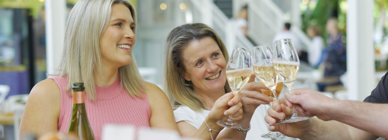 People enjoying a bottle of Grounded Cru wines. 